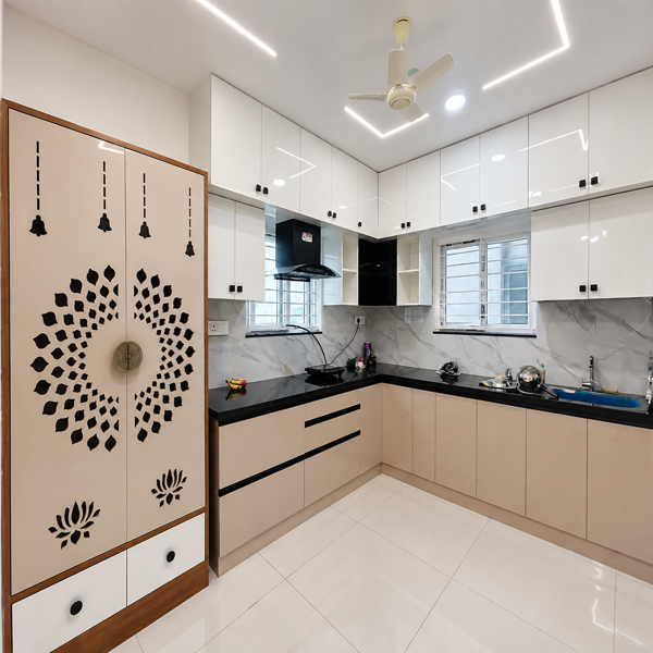 Modern kitchen, modular kitchen, luxury kitchen, contemporary interior, stylish kitchen, spacious kitchen, L-shaped kitchen, kitchen cabinets, glossy cabinets, white cabinets, beige cabinets, black countertop, marble backsplash, marble wall, elegant interiors, premium kitchen, modern apartment, residential interior, apartment kitchen, kitchen design, home interior, modern home, luxury home, kitchen storage, overhead cabinets, lower cabinets, kitchen drawers, built-in kitchen, chimney, kitchen exhaust, gas stove, cooking area, kitchen sink, kitchen appliances, kitchen utensils, clean kitchen, bright kitchen, LED lighting, ceiling lights, ceiling fan, glossy floor tiles, white flooring, decorative partition, wooden frame, room divider, wall decor, contemporary architecture, minimalist design, neat interior, organized kitchen, urban apartment.